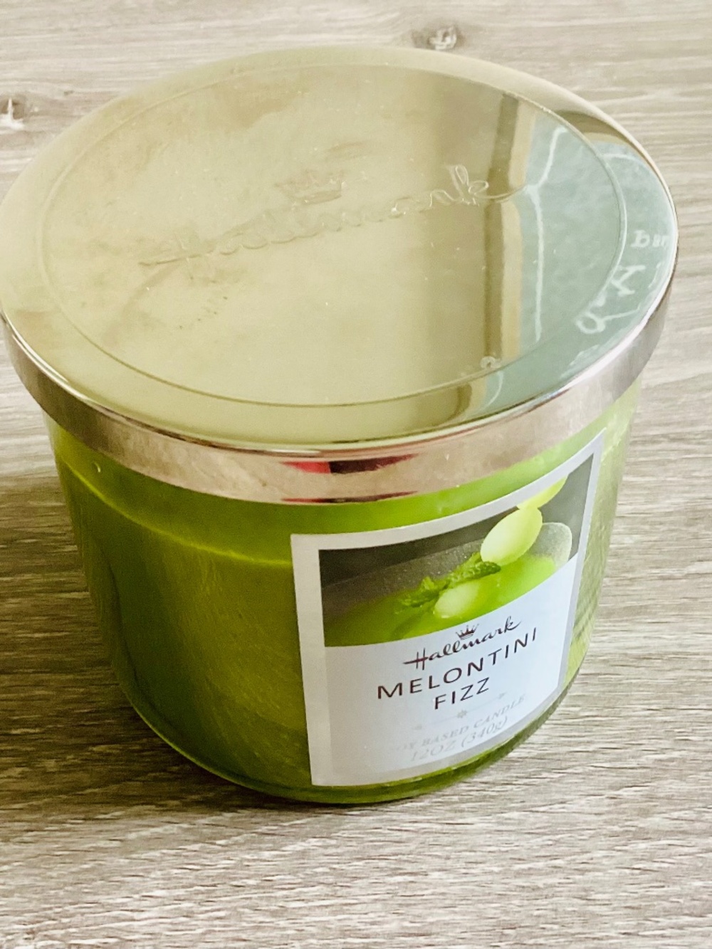 Hallmark Melontini Fizz scented candle in a 12-ounce glass jar with lid Melon
